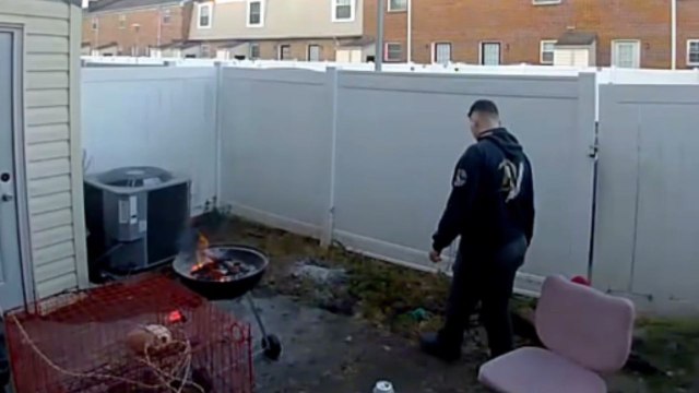 Man casually tosses can into fire and gets startled when it suddenly explodes