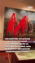 Des militants aspergent de peinture rouge un tableau en hommage à Christophe Colomb à Madrid