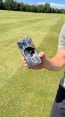 Man Accidentally Smashes Phone While Aiming for Egg in Golf Practice