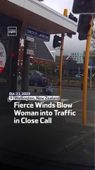 Fierce Winds Blow Woman into Traffic in Close Call