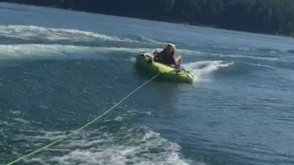 Tubing adventure turns comical as woman gets flipped into the water