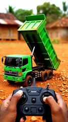 Hino Dump Truck Unloading on Red Soil