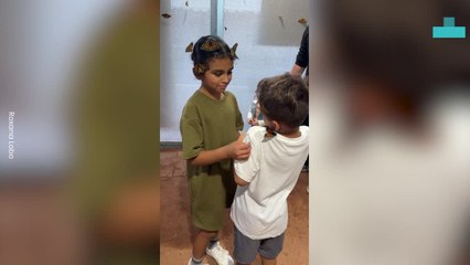 Little Girl Surrounded by Butterflies