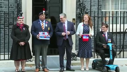 Sir Keir Starmer buys a poppy outside No 10
