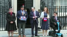 Sir Keir Starmer buys a poppy outside No 10