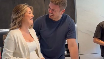 Couple reveals they are having a baby girl with a pink cake slice