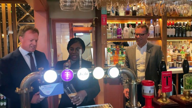 Kemi Badenoch pouring pints at The Castle pub in Farnham