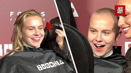 Fans line up to shave their heads for admission into an early screening of the film 'Bugonia' in LA