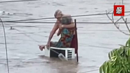 Couple embraces during deadly floods in Mexico