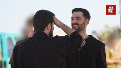 Twin brothers among released hostages greeted by cheers as they're taken to hospital