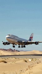 Boeing 747 landing on a sandy runway