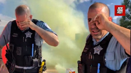 Watch Chicago police cough and struggle after Federal Agents throw tear gas