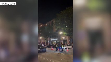 Protesters line up in DC and yell at police after Trump announces crime crackdown