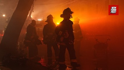Dramatic POV of FDNY firefighters running into a burning building