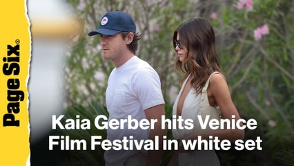 Kaia Gerber hits Venice Film Festival in plunging white skirt set with Lewis Pullman