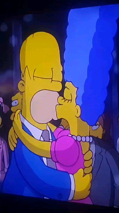 The Simpsons Homer and Marge Simpson are Hugging Husband and Wife