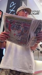 Giants QB Jaxson Dart reading today’s New York Post during Crocs TikTok Shop takeover in SoHo