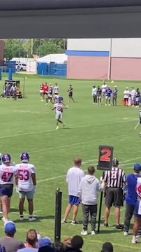 Russell Wilson connects with Malik Nabers on a deep pass at Giants camp