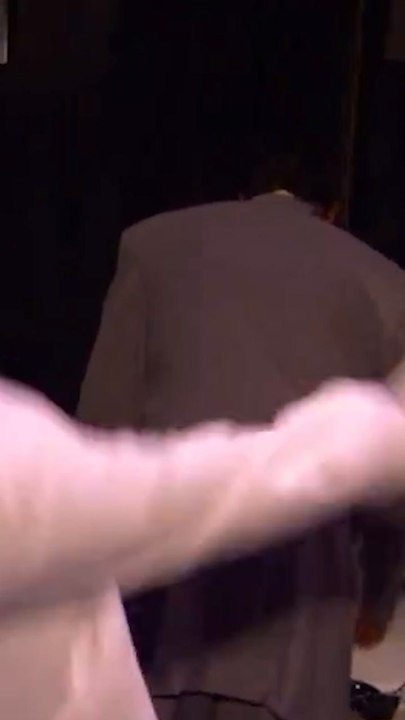 David Stern trying on LeBron James' suit jacket during the 2003 NBA Draft