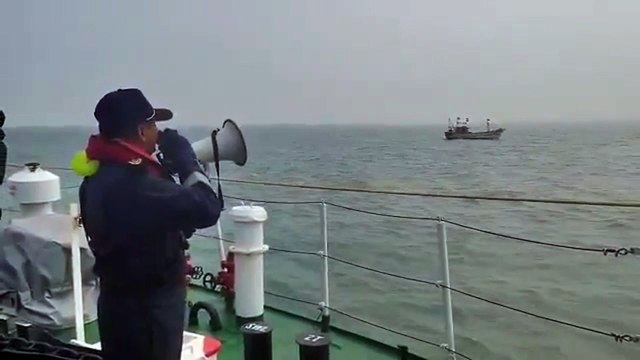 Indian Coast Guard Team cautioning Fisher Boat/Fishermen about bad weather and advise them of safety