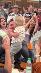 Crowd Cheers As Toddler Chugs Milk At Oktoberfest