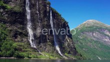 The Sven sisters waterfall - an iconic feature of the Geiranger fjord, Norway. Seven steams falling