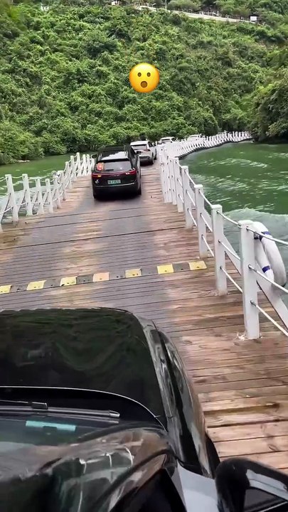 The Shiziguan Floating Bridge_ located in Enshi Prefecture_ _China_ is a unique attraction that allows visitors to drive across the water on a bridge made o(