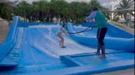 Girl tries Flowrider at Moon Palace Cancun and finally manages to stay upright
