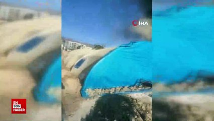 Hatay'da alevlerin arasına dalan operatör, konteyneri uçurumdan yuvarladı