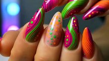 Bright neon swirl nail art in pink, green, and orange