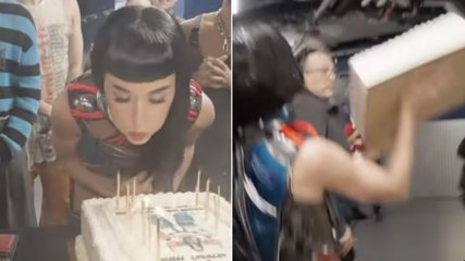 Katy Perry throws birthday cake at tour crew in bizarre video