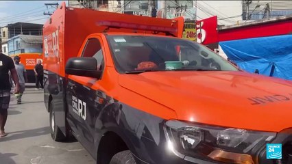Brazilians in a Rio favela line up bodies after the city's deadliest police raid