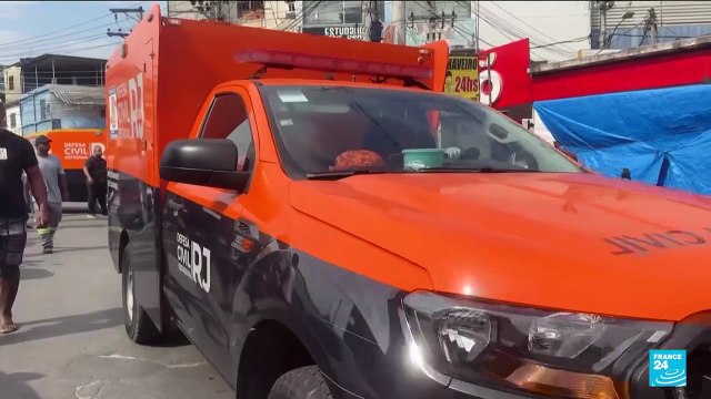 Brazilians in a Rio favela line up bodies after the city's deadliest police raid