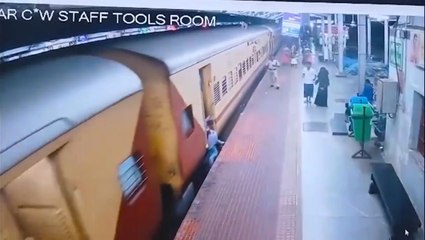 Woman who slips whilst boarding moving train saved by station guard