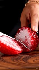 Cutting strawberries in a glass. ASMR