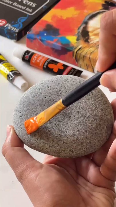 Hauntingly Cute Pumpkin Rock Painting for Halloween 🎃