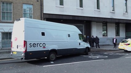 Van leaves court where man appeared charged with murder after triple stabbing