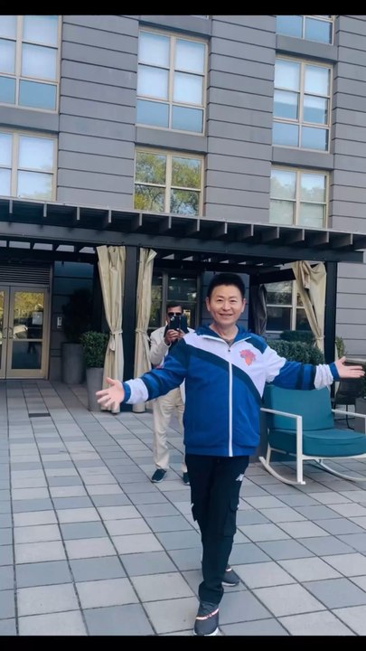 In the courtyard of The Octagon, a luxury apartment building on Roosevelt Island in Manhattan, Nelson Wang, a Chinese-American resident, was dancing gracefully. Photographed on October 21, 2025.