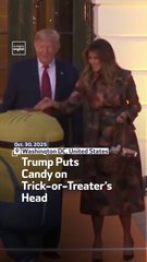 Trump Puts Candy on Trick-or-Treater’s Head
