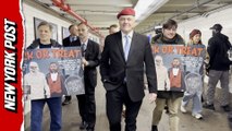 Curtis Sliwa campaigns in subway with Halloween sign trashing challengers Cuomo and Mamdani
