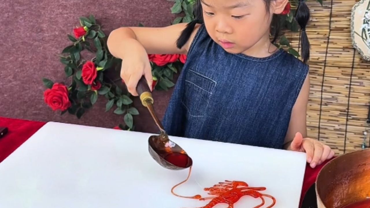 Traditional ancient Chinese craft brings a dragon and fish to life