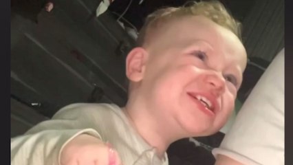 Little boy feels disgusted when girl places the eye mask on his hand