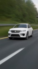 Car is running in high speed  from backside of the road.