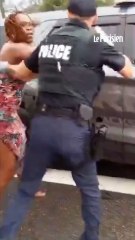 un arrestation qui se passe mal entre une femme et un policier