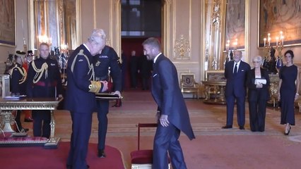 Sir David Beckham! England legend receives knighthood from the King as proud Victoria watches on