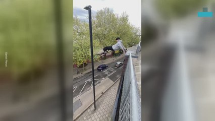Parkour Fail as Man Tries to Leap From Roof to Lamppost