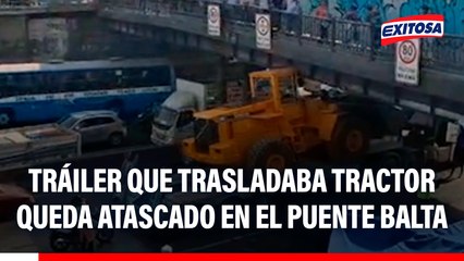 Tráiler que trasladaba tractor quedó atascado en el Puente Balta