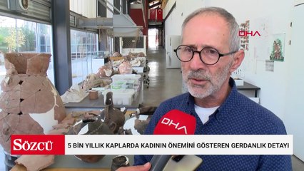 5 bin yıllık kaplarda kadının önemini gösteren gerdanlık detayı