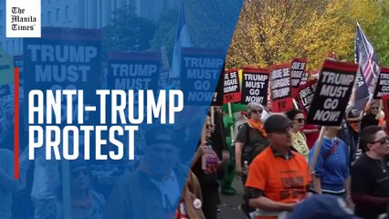 Anti-Trump protesters gather in Washington D.C. to mark one-year since Donald Trump's re-election