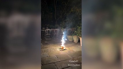 Sir David Beckham runs for cover as firework explodes in front of him